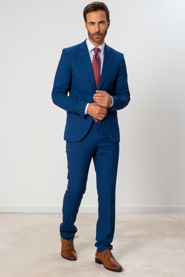 Traje elástico micropuntillé azul...