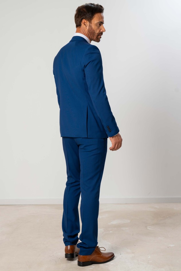 Traje elástico micropuntillé azul...