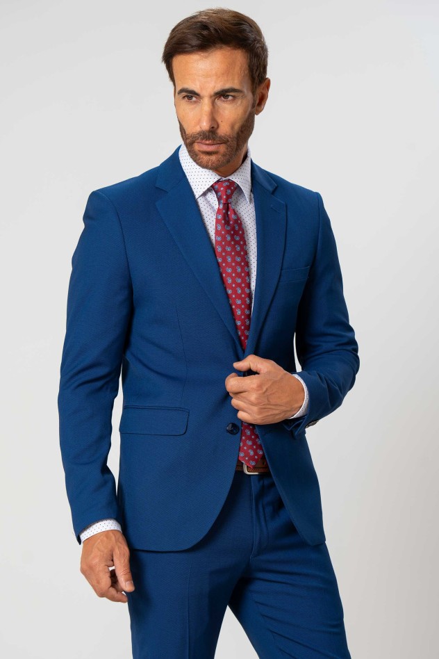 Traje elástico micropuntillé azul...